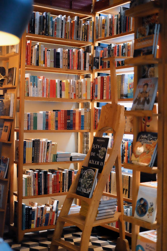 about-01 Warm interior of a cozy bookstore with books neatly arranged on wooden shelves.